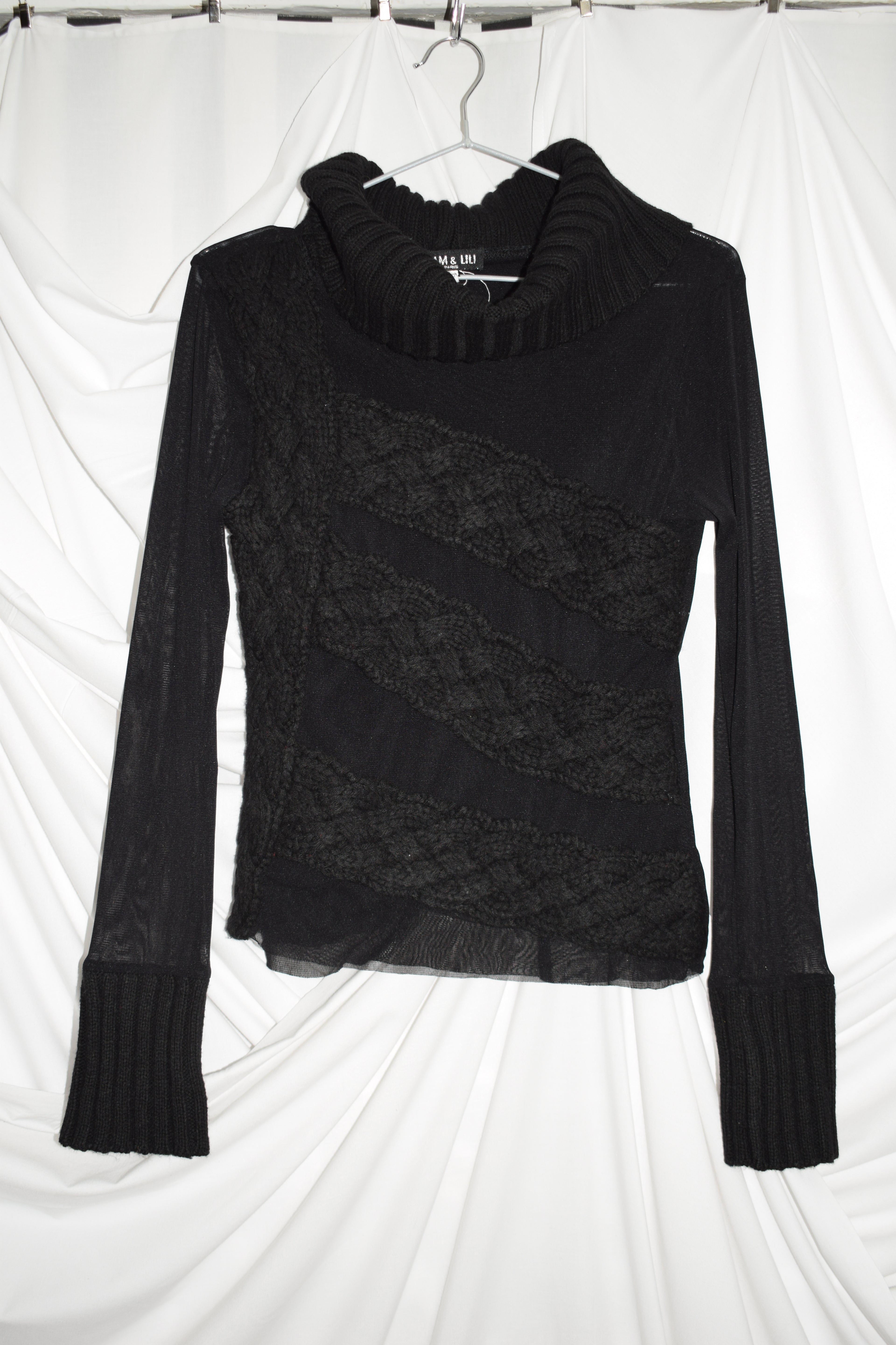 BLACK TURTLE NECK TOP WITH KNIT DETAILS