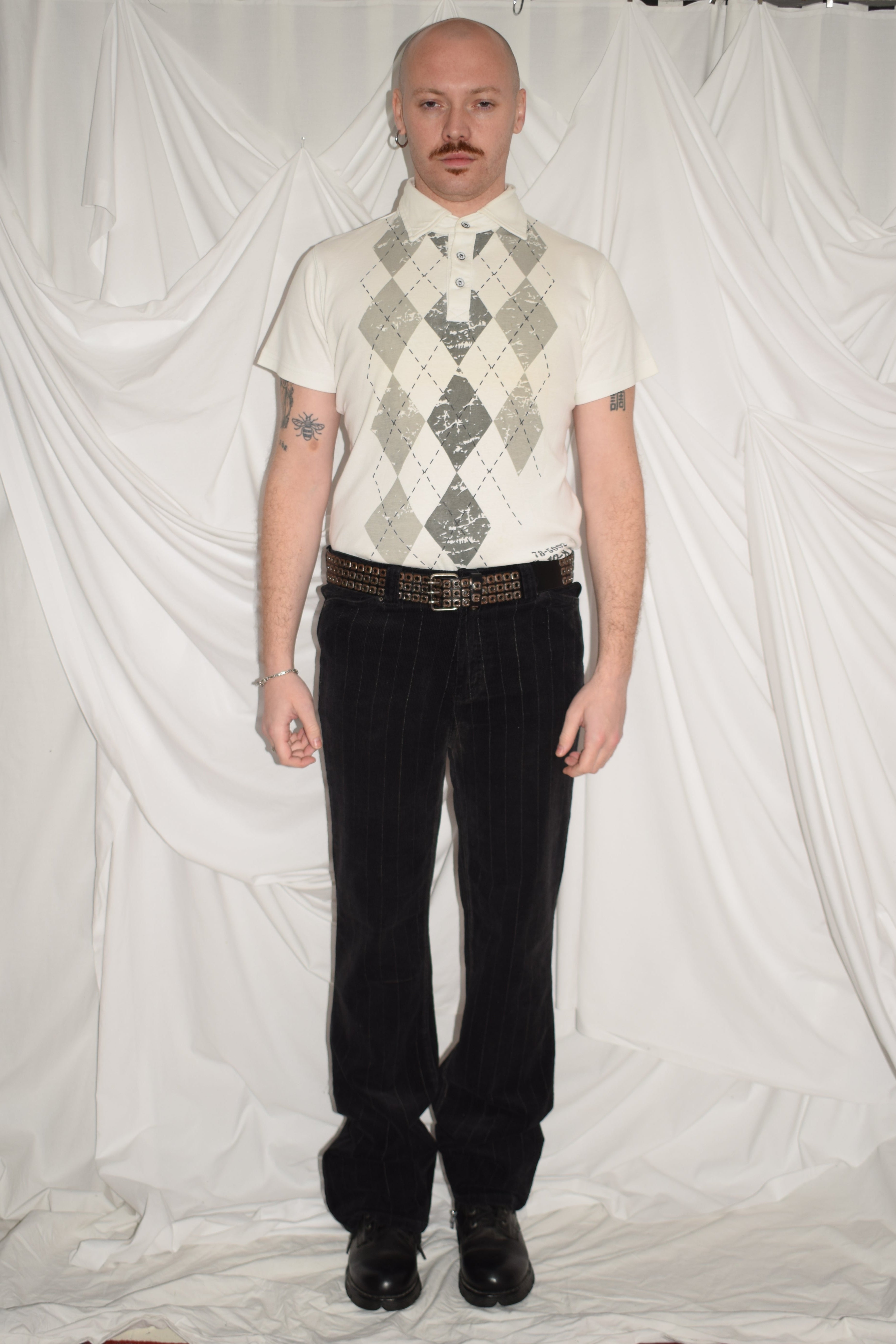 WHITE POLO TOP WITH ARGYLE PRINT